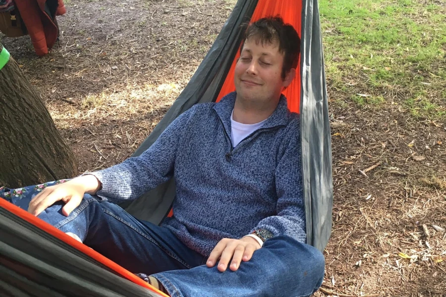 Relaxing in a hammock at a Ways to Wellness event
