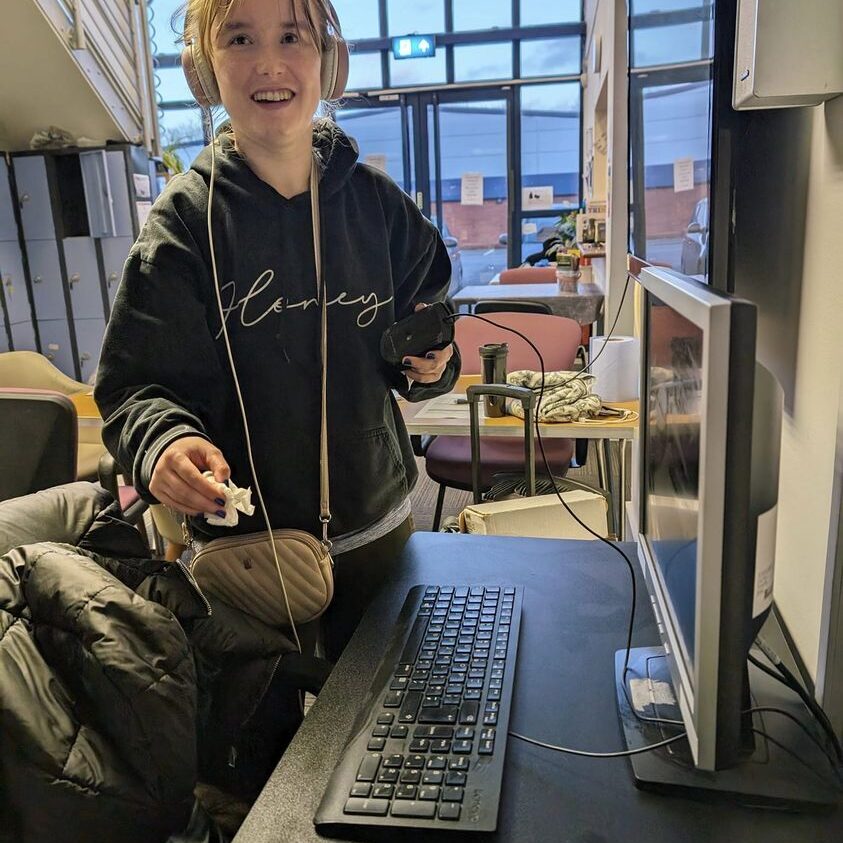 A lady with a computer learning new skills - Employment support in Oxfordshire, Style Acre