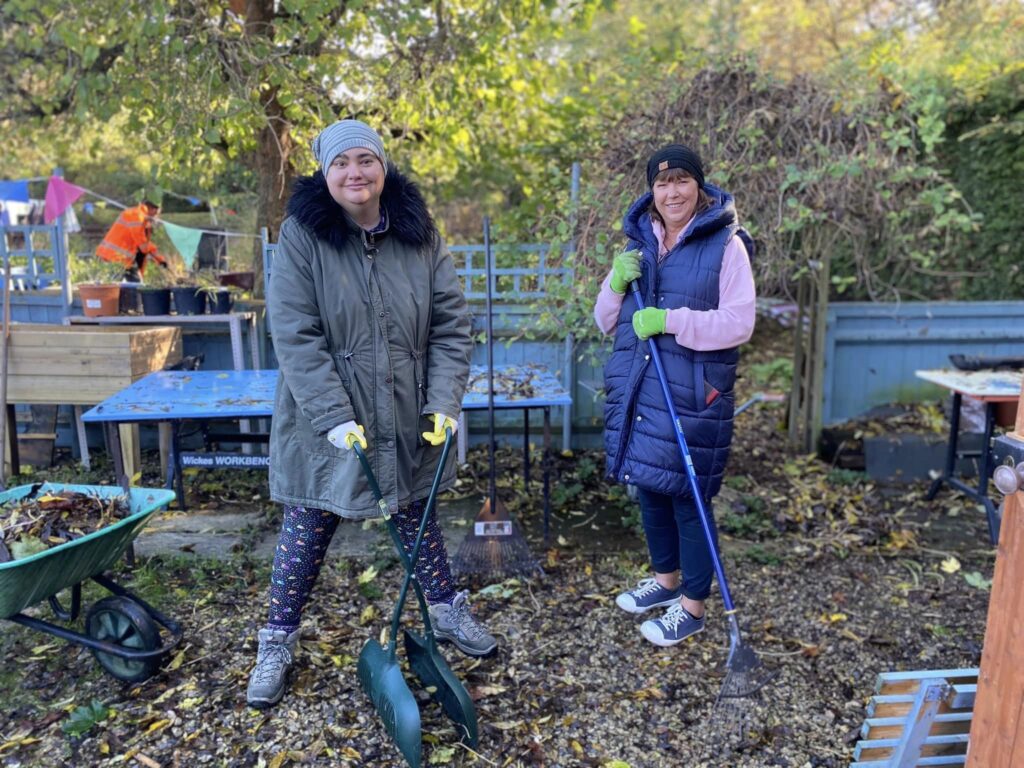 Two ladies learning gardening skills at Wantage Garden project in Oxfordshire