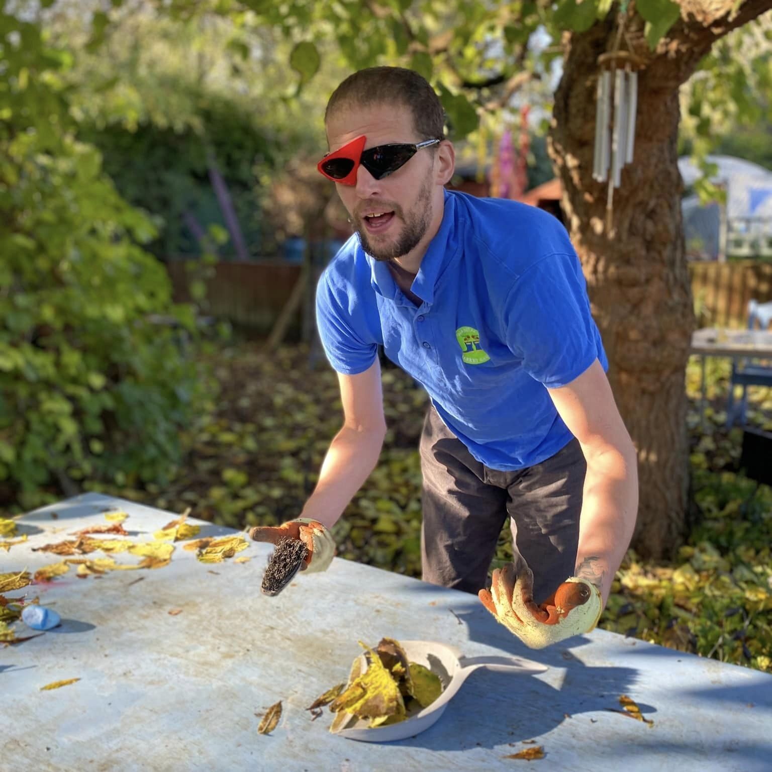 One of the Green Acre team helping clear leaves at Wantage Market Garden -Green Acre Garden Maintenance in Wallingford Didcot