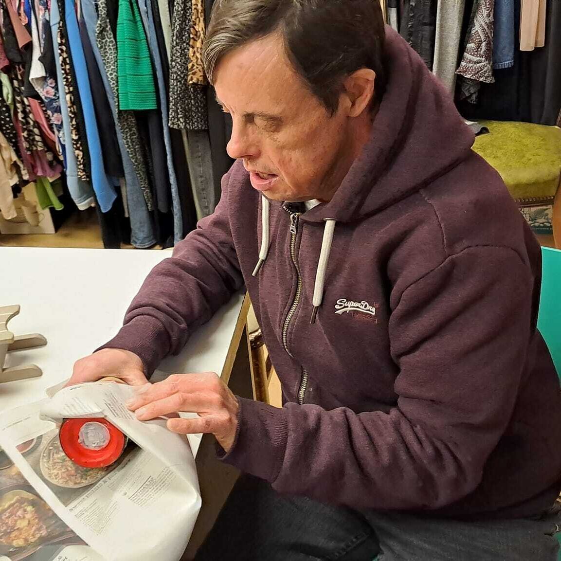 Man enjoying working at the Charity Shop in Wallingford - Employment support in Oxfordshire, Style Acre