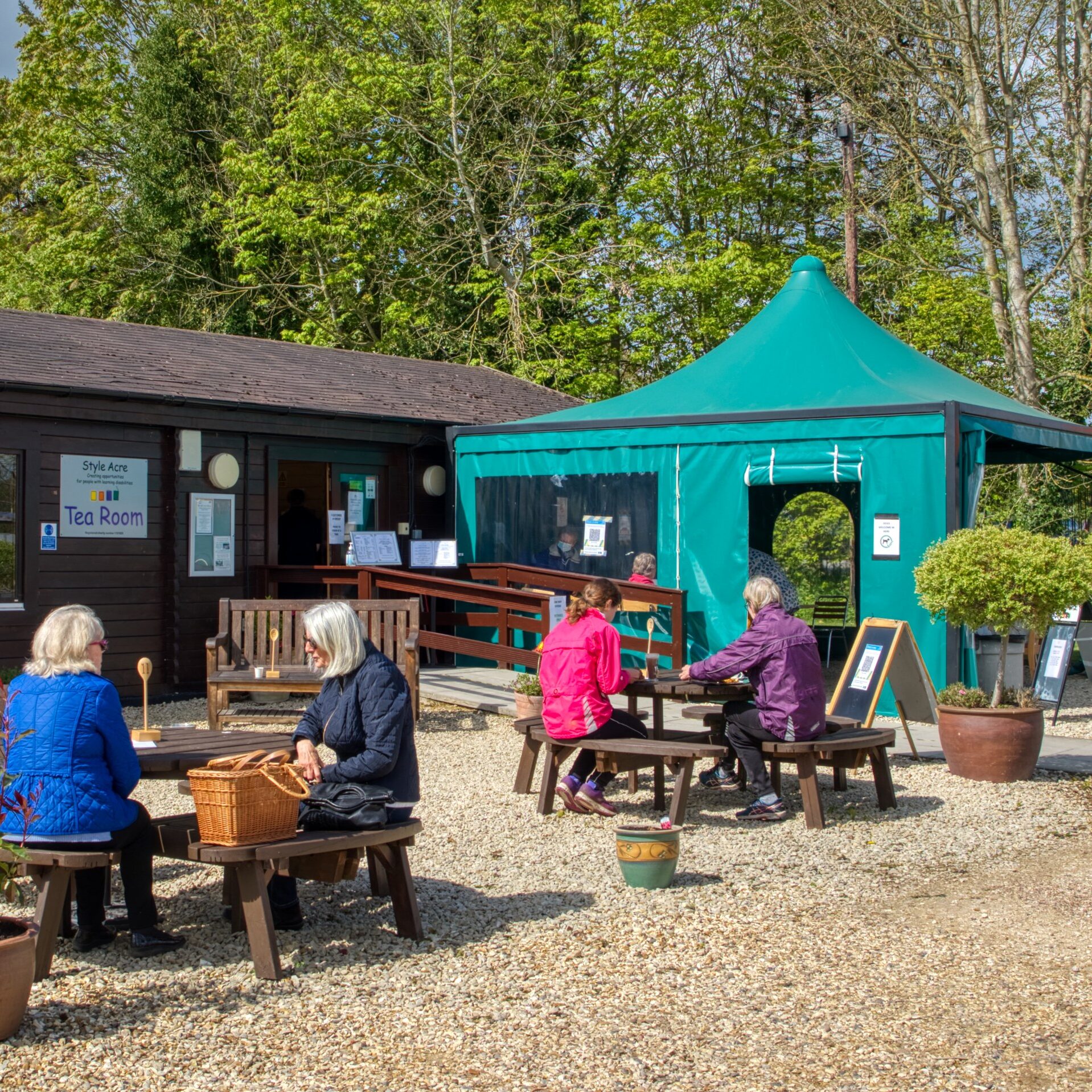A group of people enjoying sitting outside at the Style Acre Tea Room, Savages, Blewbury