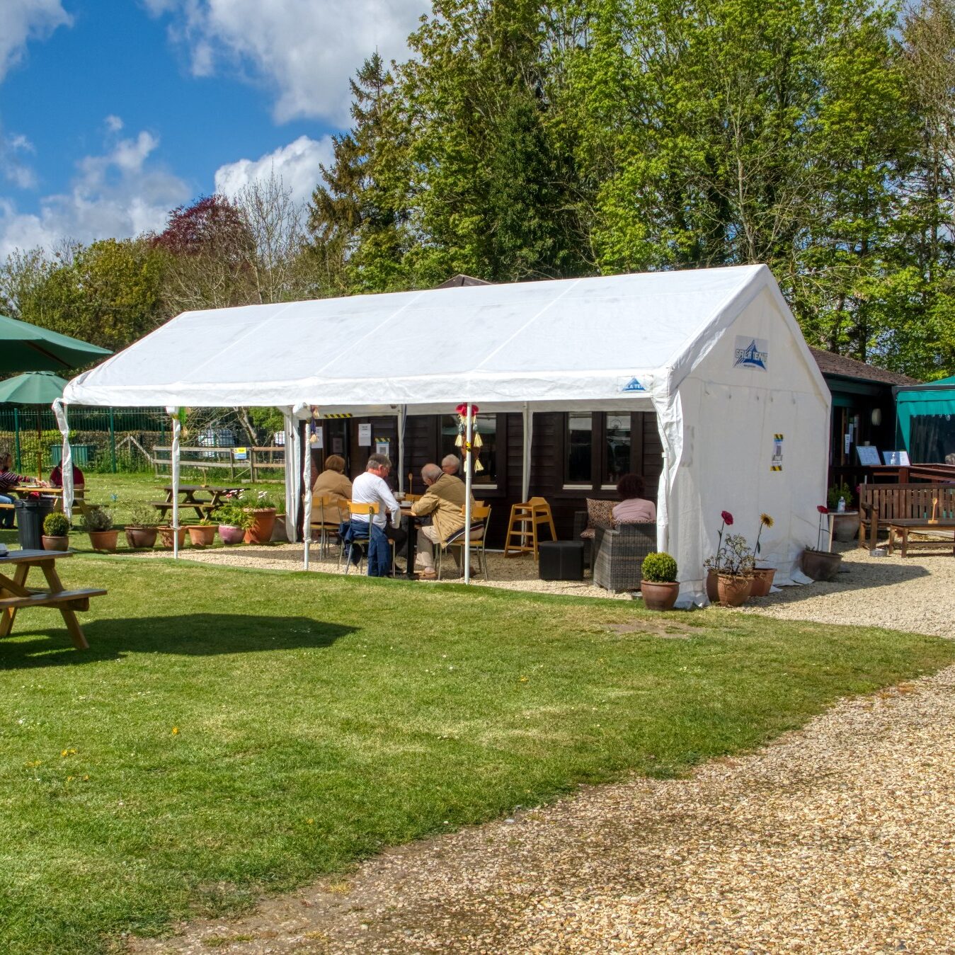 People enjoying the outside areas at the Style Acre Tea Room, Savages Blewbury