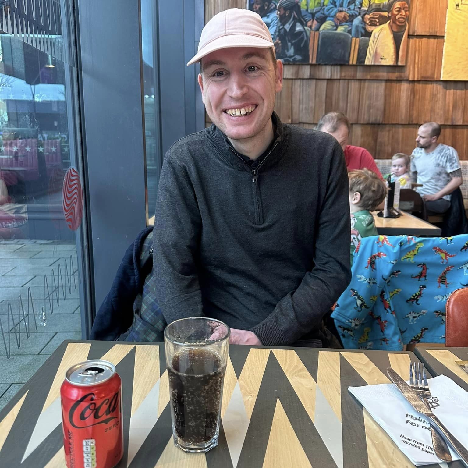 A gentleman enjoying a coke with community support in Oxfordshire
