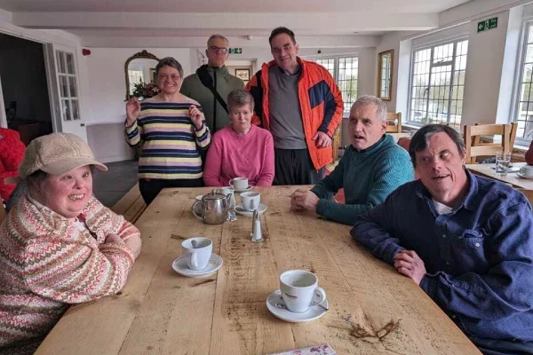 A group of friends enjoying a drink at a cafe and socialising from our houses