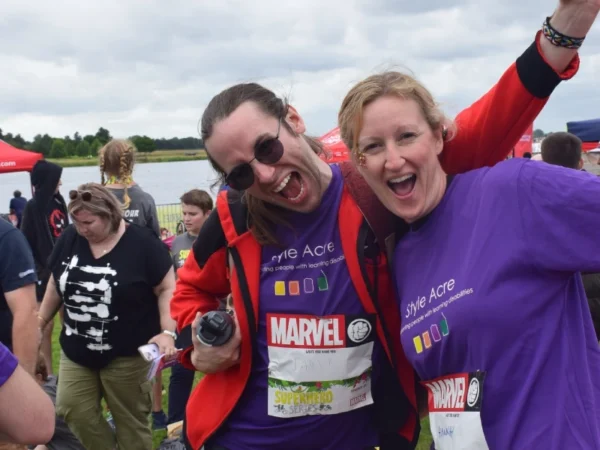 Two people taking part in a challenge fundraising for Style Acre