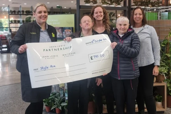 Team from Banbury collecting a cheque from money raised by Waitrose