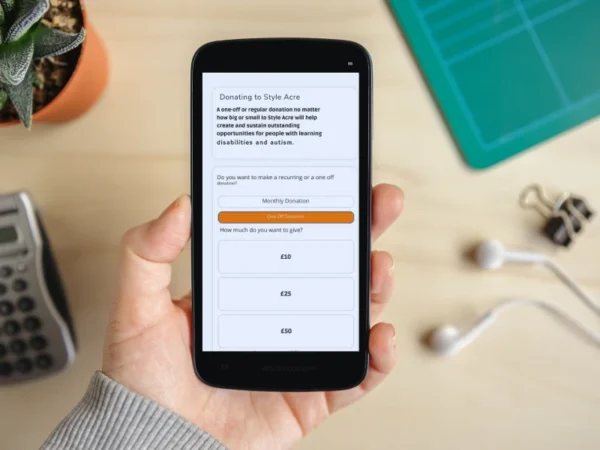 An online form on a phone where people can donate and fundraise for Style Acre