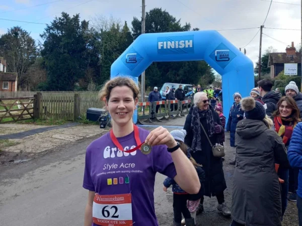 Our Style Acre Ambassador showing her medal after running 10K fundraising for Style Acre