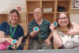 Team of medal makers showing their medals