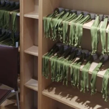 Rows of biodegradable medals made by the medal making social enterprise at Banbury