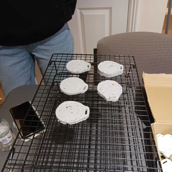 5 Style Acre environmentally friendly biodegradable medals being made on a rack and used for their Santa Dash in Wallingford.
