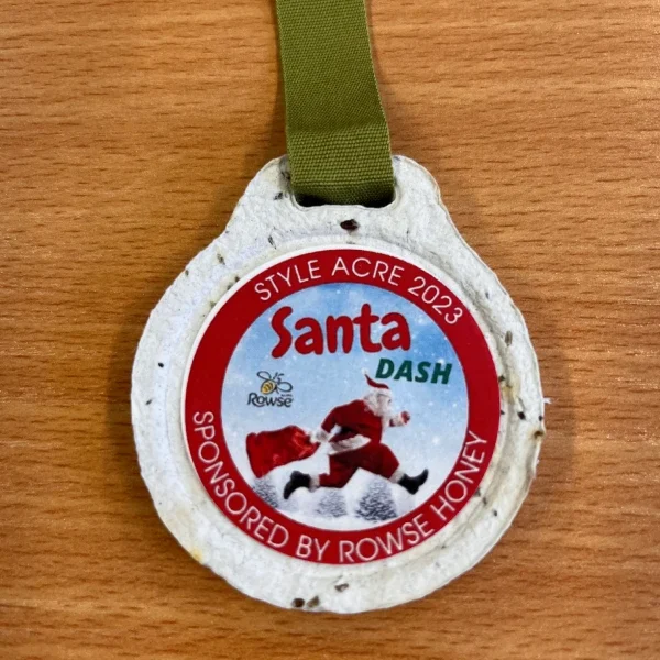 A style Acre biodegradable medal that they used for their Santa Dash in Wallingford.