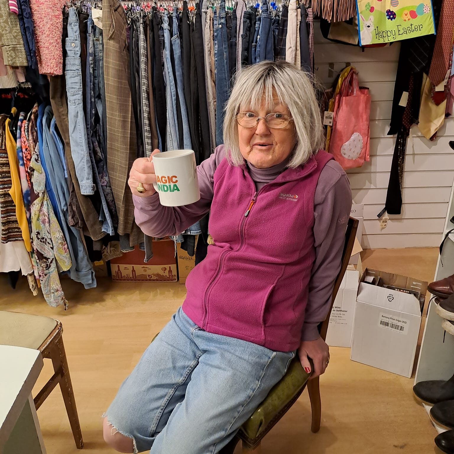 A lady enjoying a cup of tea at the Style Acre Charity Shop