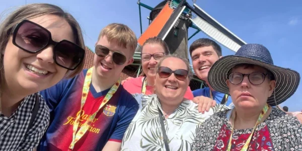 A group of people and their support team on holiday, live your life