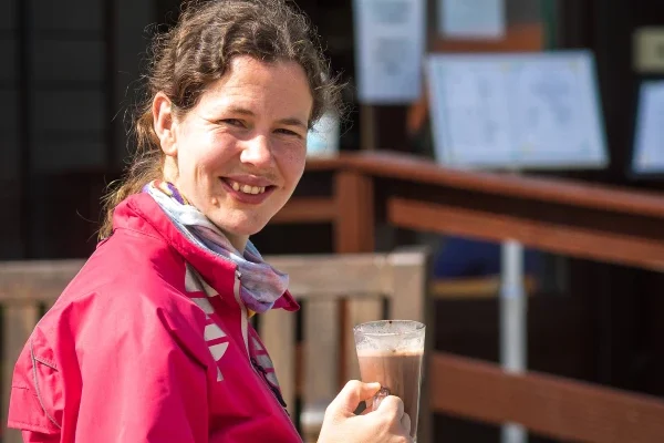 A lady drinking hot chocolate at the Style Acre Tea Room, social enterprise