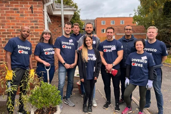 Volunteers from Invesco helping at a supported living house in Henley.