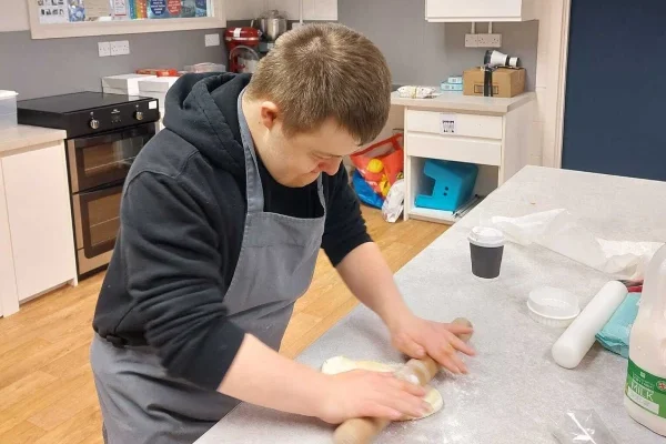 A gentleman learning cooking skills with community support in Oxfordshire