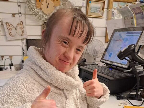 Person we support with their thumbs up