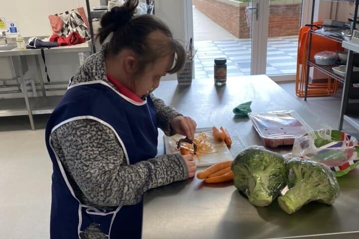 Chopping vegetables whilst at work.