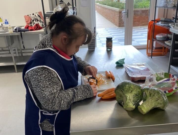 Chopping vegetables whilst at work.