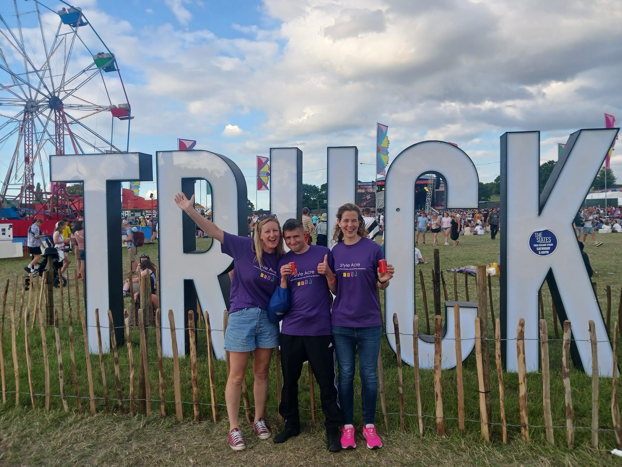 Fun at Truck Three people in front of the Truck sign
