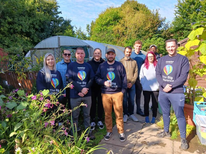 A group of volunteers, 6 men and 4 women, from Centrica standing as a group in the Wantage Market Garden.