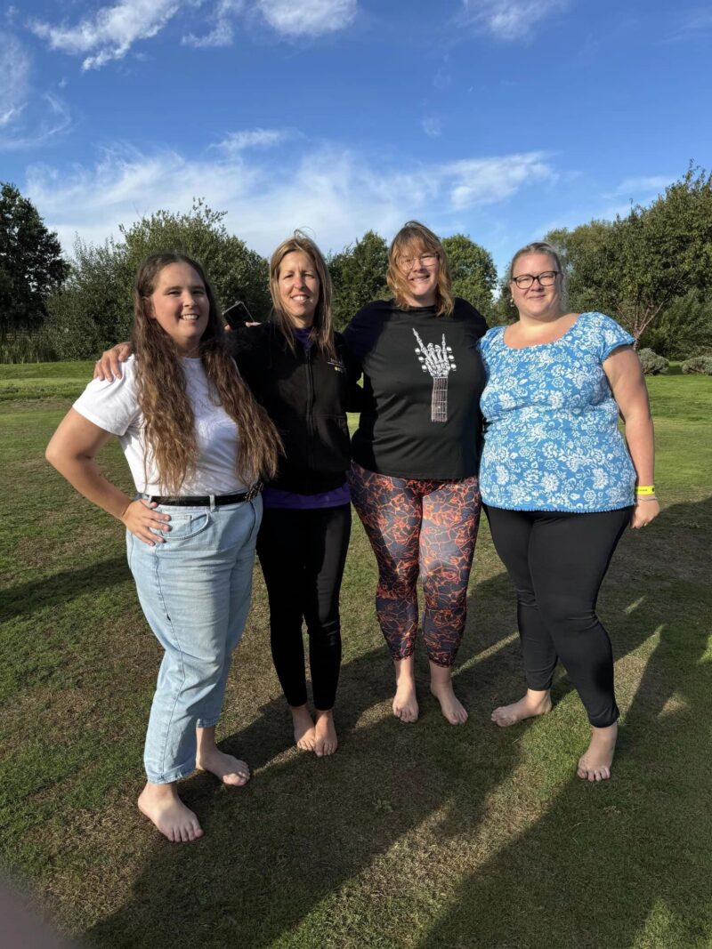 Group of four ladies waiting to take on a Firewalk