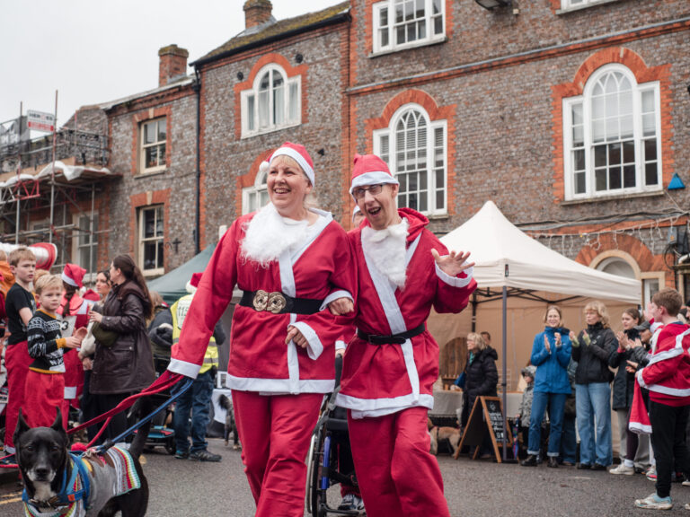 Santa Dash 24 tow people and their dog running to the finish line