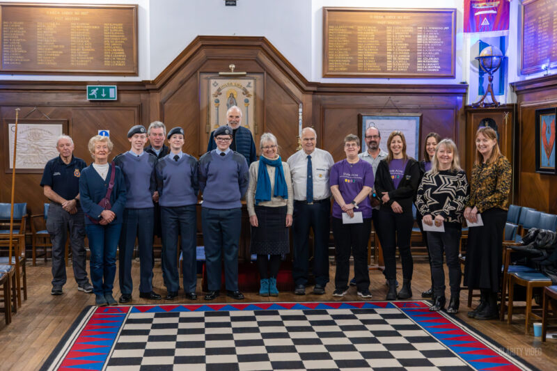 Photo of people from all the charities receiving a donation from Ingham Lodge