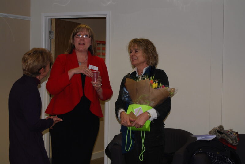 Sinead Cusack being presented flowers at the opening of T2 community hub in 2012