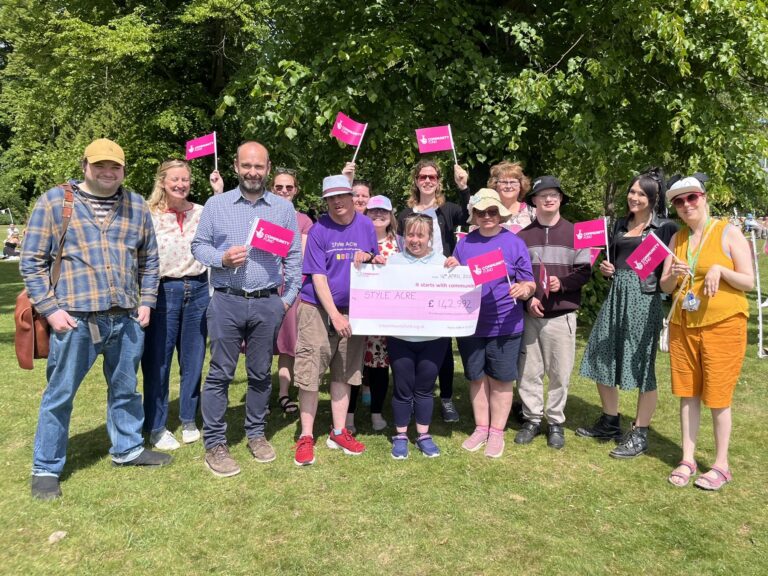 National Lottery Community Fund Group of people from Style Acre holding a cheque from the National Lottery Community Fund