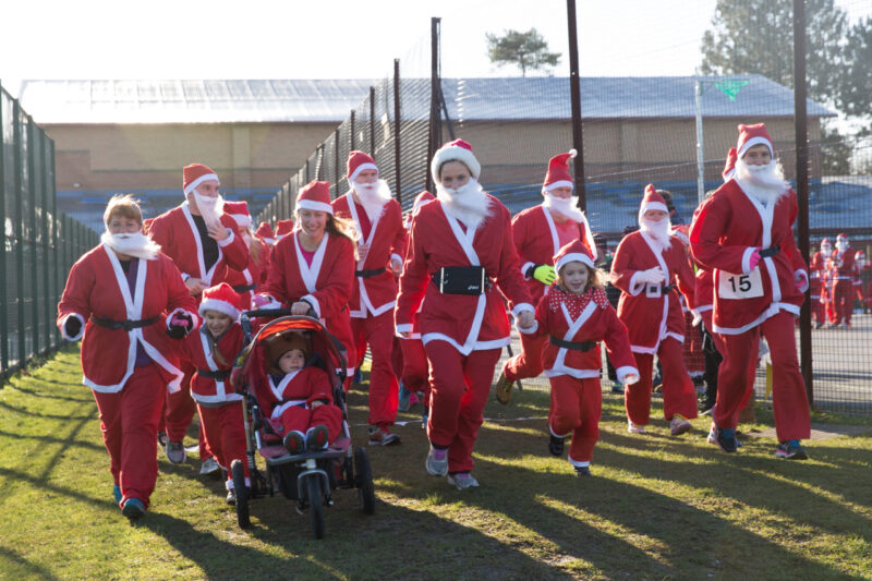 Start of the Santa Dash 2016, with everyone in Santa suits.