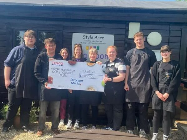 Square images for wesbite (600 x 500 px) (6) 8 people standing outside the tea room holding a large cheque for £1000