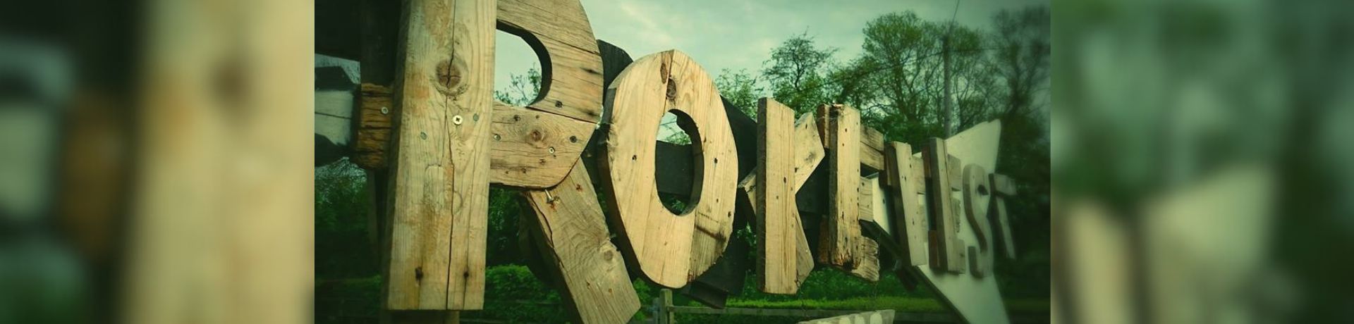 Photo of a sign saying Rokefest made out of wood boards