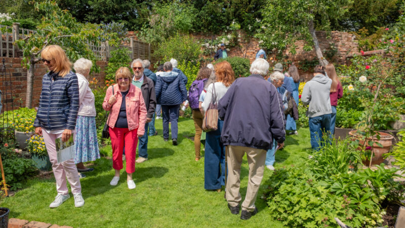 Visitors at Wallingford Walled gardens looking round a garden