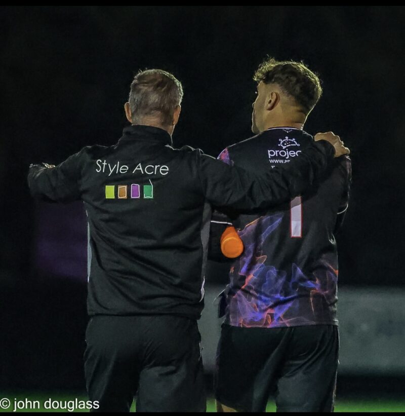 Manager and football player in kit, with Style Acre logo