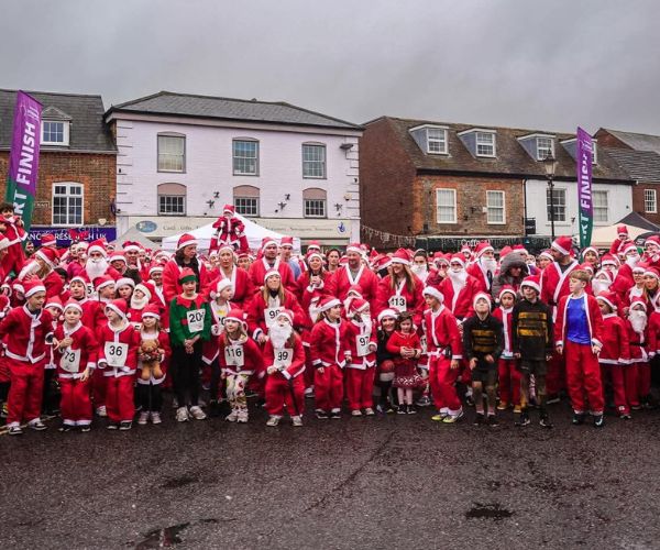 Square images for wesbite (600 x 500 px) (10) Group of adults and children dressed in Santa suits