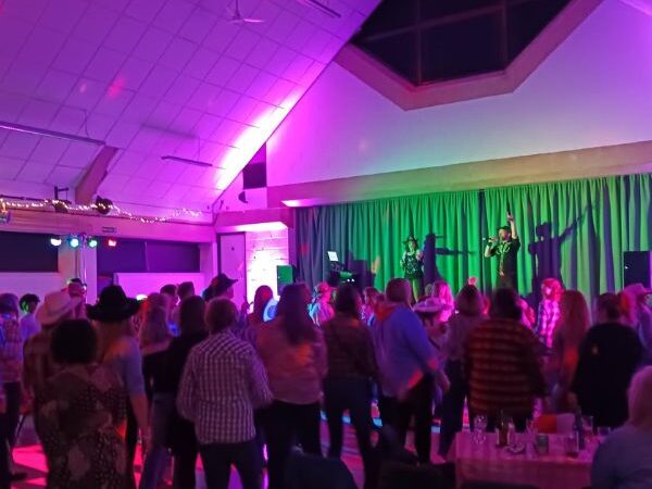 People up and dancing at the Barn Dance