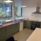 Newly fitted green kitchen units at Turnstyle community hub